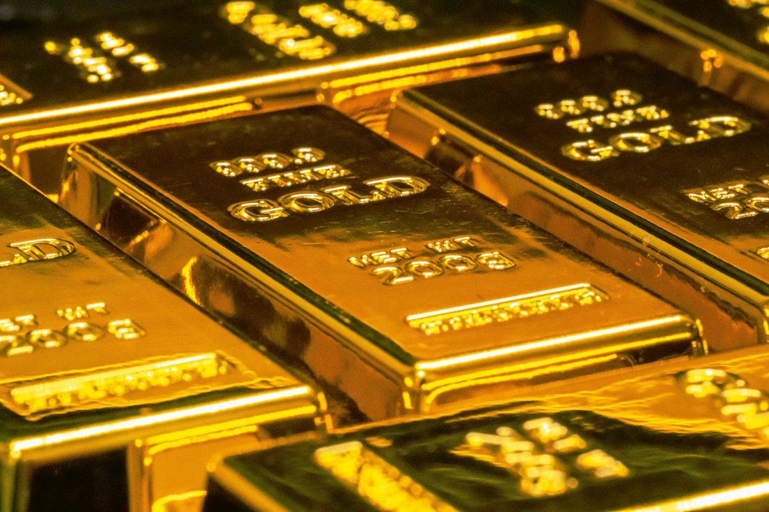 Gold bars stacked in a vault