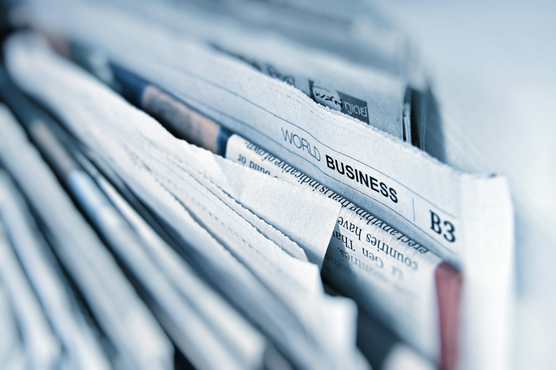 A newspaper with financial headlines